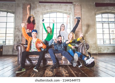 Mixed Race Group Of Teenagers Having Fun On The Couch - Multi-ethnic Young Adults Partying At Home