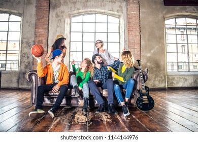 Mixed Race Group Of Teenagers Having Fun On The Couch - Multi-ethnic Young Adults Partying At Home