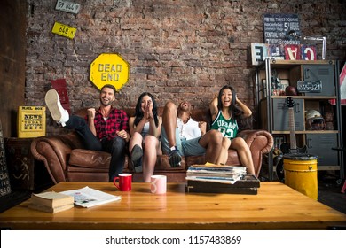 Mixed Race Group Of Teenagers Having Fun On The Couch - Multi-ethnic Young Adults Partying At Home