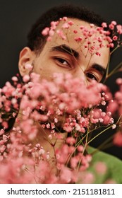 Mixed Race Guy Posing With Dry Flowers