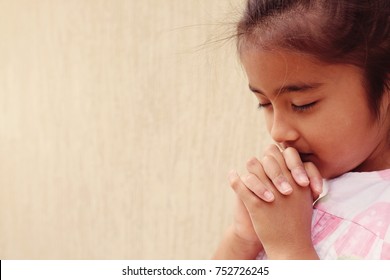 Mixed Race Hispanic Girl Child Praying Alone With Eyes Closed, Christianity Faith Concept, World Day Of Prayer,international Day Of Prayer,
Hope, Gratitude, Thankful, Trust Concept