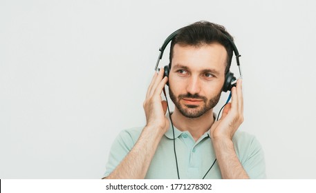 Mixed Race Man Getting A Hearing Test, Audiometer Hearing Test. On Grey Background