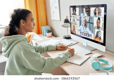 Mixed race teen school girl college student distance learning during virtual remote class, group online lesson on video conference call with teacher on computer screen studying at home by videocall. - Shutterstock ID 1866193567