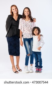 Mixed Race Woman Family Mom And Daughters Happy Together Posing For Portrait In Studio Isolated Background