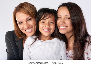 Mixed Race Woman Family Mom And Daughters Happy Together Posing For Portrait In Studio Isolated Background