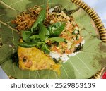 mixed rice with pecel chili sauce, Indonesian food combined with fried tempeh