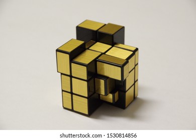 Mixed Rubic Toy. Gold And Black.