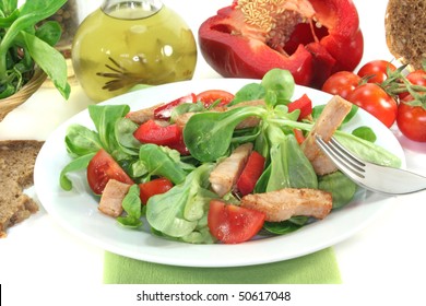 Mixed Salad With Chicken Strips On A White Background