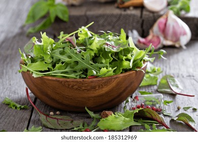 Mixed Salad Green Leaves In A Wooden Bowl