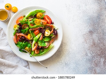Mixed salad leaves, cherry tomatoes and salted salmon salad on stone background. Flat lay. Copy space - Shutterstock ID 1885780249