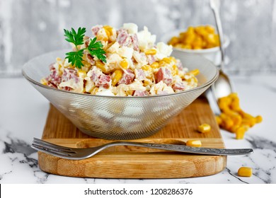 Mixed Salad From Salami Sausage, Cheese, Boiled Egg And Canned Corn With Mayonnaise Dressing