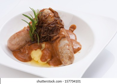 Mixed Sausages Grilled in white bowl isolated on white.