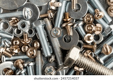 Mixed screws and nails. Industrial background. Home improvement.bolts and nuts.Close-up of various screws. Use for background, top view.