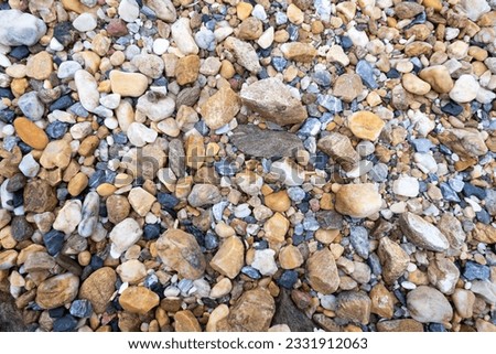 Mixed sea gravels. River gravels background.
