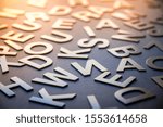 Mixed solid letters pile closeup photo. Education background concept