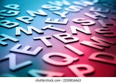Mixed solid letters pile closeup photo. Education background concept
