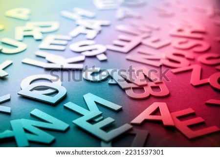 Mixed solid letters pile closeup photo. Education background concept