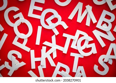 Mixed solid letters pile top view photo. Education concept on red background. - Powered by Shutterstock - Get 15% off with code: PIKWIZARD15