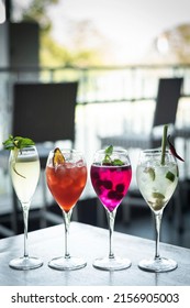 Mixed Spritzer Wine Cocktails Selection With Fruit In Outdoor Bar Table