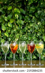 Mixed Spritzer Wine Cocktails Selection With Fruit In Outdoor Bar Table