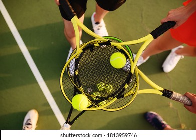 Mixed tennis, players with rackets and balls