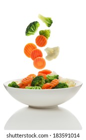 Mixed Vegetables Falling Into A Bowl Of Salad