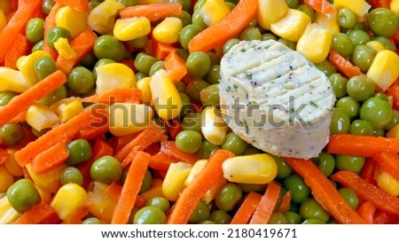 Mixed vegetables and garlic butter carrots, sweetcorn and peas