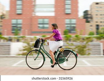 mixed-race businesswoman going to work by bike.