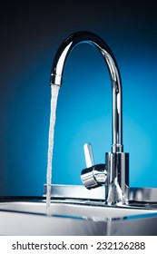 Mixer Tap Flowing Water Blue Background Stock Photo (Edit Now) 234815797