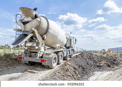 Mixer truck is transporting cement to the casting place on building site.