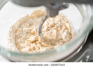 Mixing Bread Dough In A Stand-alone Kitchen Mixer To Bake Patriotic Cinnamon Twists.