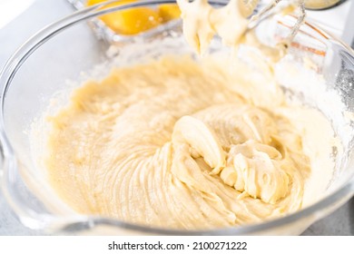 Mixing ingredients into the batter for lemon pound cake.