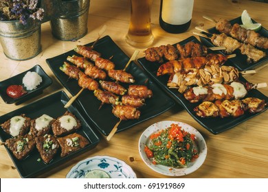 Mixing of Japanese food Izakaya style, Beef, Chicken, Beacon, Beer, Party set menu concept