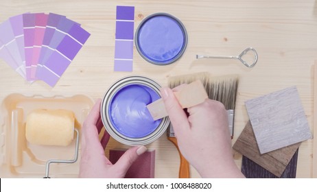 Mixing New Purple  Paint With Wooden Paint Stick.