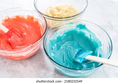 Mixing Red And Blue Food Coloring Into The Cake Dough.