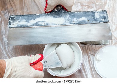 Mixing, Stirring Gypsum Putty With A Spatula Close-up