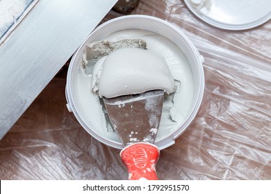 Mixing, Stirring Gypsum Putty With A Spatula Close-up