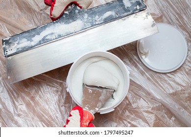 Mixing, Stirring Gypsum Putty With A Spatula Close-up