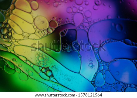 Mixing water and oil to form beautiful colorful abstract backgrounds 