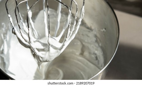 Mixing Whipped Cream in a Stand Mixer with a Whisk Attachment: Heavy whipping cream mixed with a stand mixer wire whisk