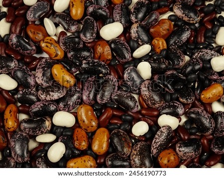 Mixture of assorted beans of different varieties, natural background