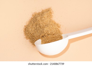 Mixture Of Biologically Active Additives For Gut Health. White Scoop Of Dietary Fiber On A Beige Background. Dietary Herbal Supplements. Gut And Stomach Health Concept. Top View, Horizontal.