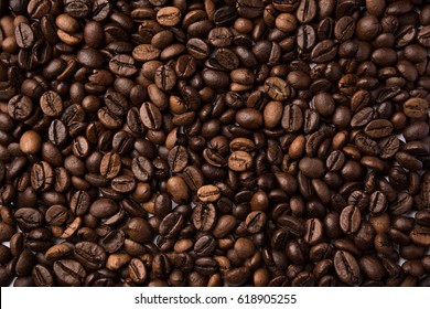 Mixture of different kinds of roasted coffee beans. Coffee Background - Shutterstock ID 618905255