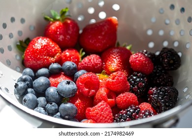 A mixture of fresh berries washed with water - Shutterstock ID 2174982469