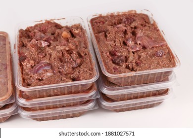 Mixture of homemade biologically appropriate raw food for dogs or cats containing meat and liquidized vegetables and fruits packed in containers for daily portions - Shutterstock ID 1881027571