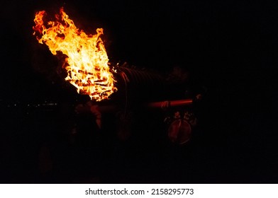 Miyajima, Japan - December 31, 2019. Participants Of The Chinkasai Fire Festival At Itsukushima Shrine, Near Hiroshima, Carry Large Burning Torches Around The Sea Shore As Part Of A Ritual To