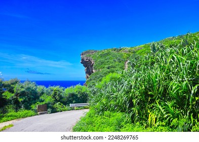 Miyakojima, Okinawa Prefecture, in the midsummer of sunny weather. The scenery of the south coast road and the Muygar Cliff of Miyako Island - Shutterstock ID 2248269765