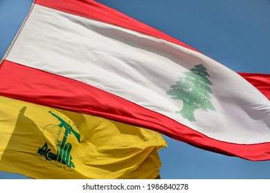 MLEETA, LEBANON - 05 10 2021 : Flag Of Hezbollah And Lebanon Fluttering In The Sky