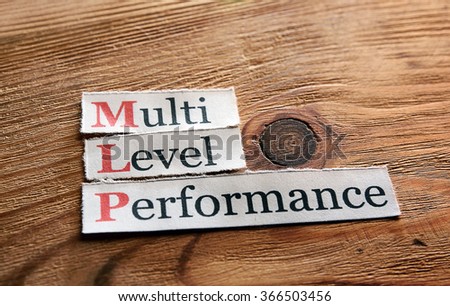 MLP- Multi Level Performance written on paper on wooden background