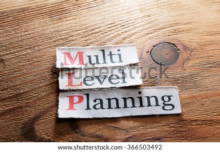 MLP- Multi Level Planning  written on paper on wooden background